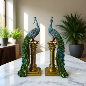 A pair of exquisite peacock ornaments standing on Roman columns.